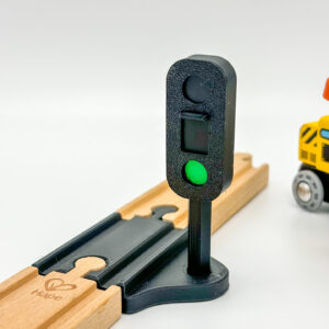 Werkende stoplicht voor houten trein